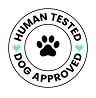 A circular graphic seal with the text 'HUMAN TESTED DOG APPROVED' in black around a white ring, with a blue paw print in the center.
